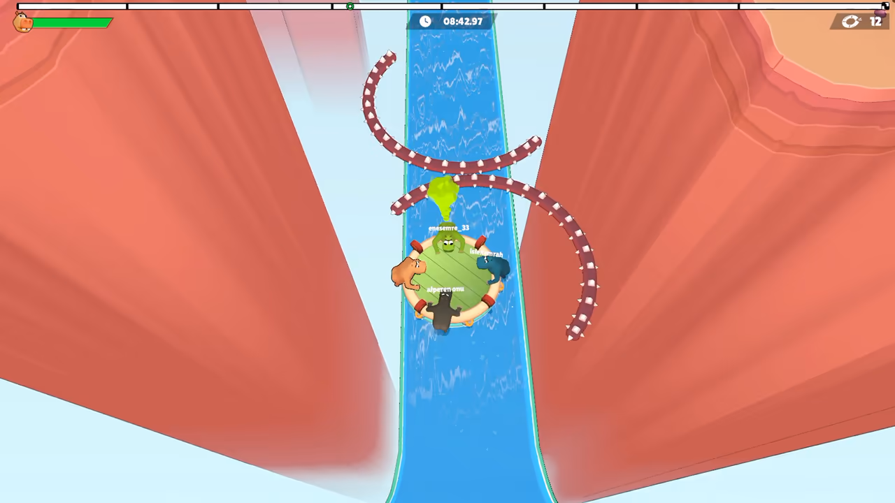 Hippos share a raft between canyon walls and red spiked barriers.